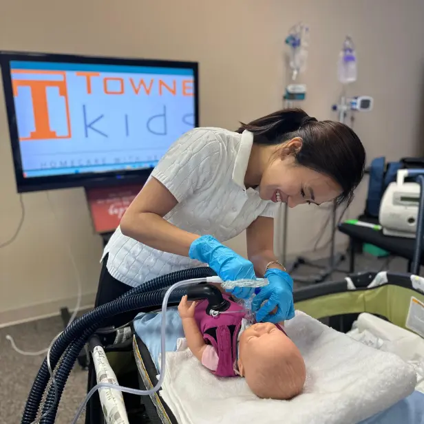 Filipino nurse preparing for pediatric care during training under Towne Kids’ USRN jobs with visa sponsorship program